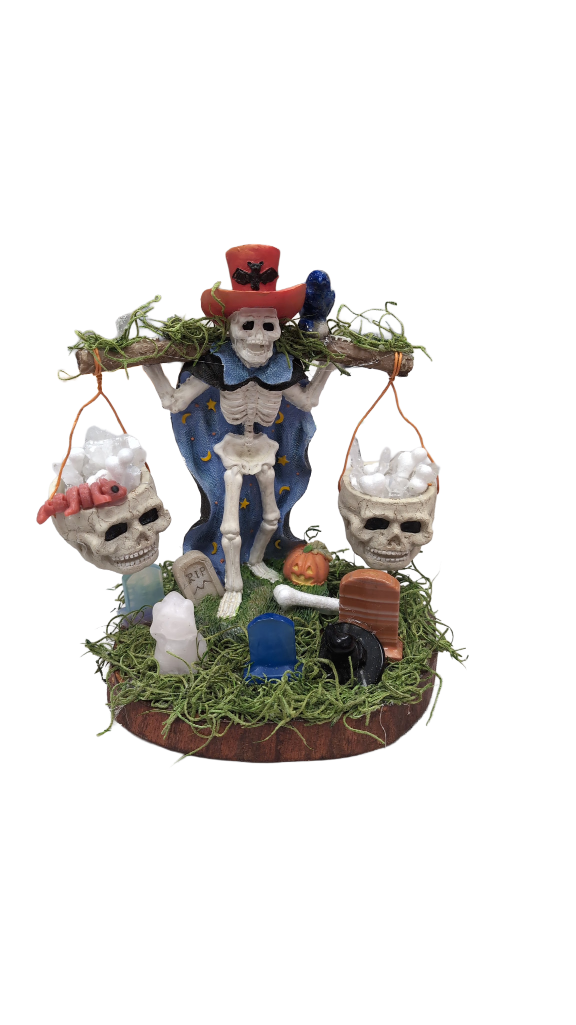 The Halloween crystal garden prize donated by Deb's Crystal Gardens: a skeleton in a red hat, hanging skulls, crystals, and a moss-covered base