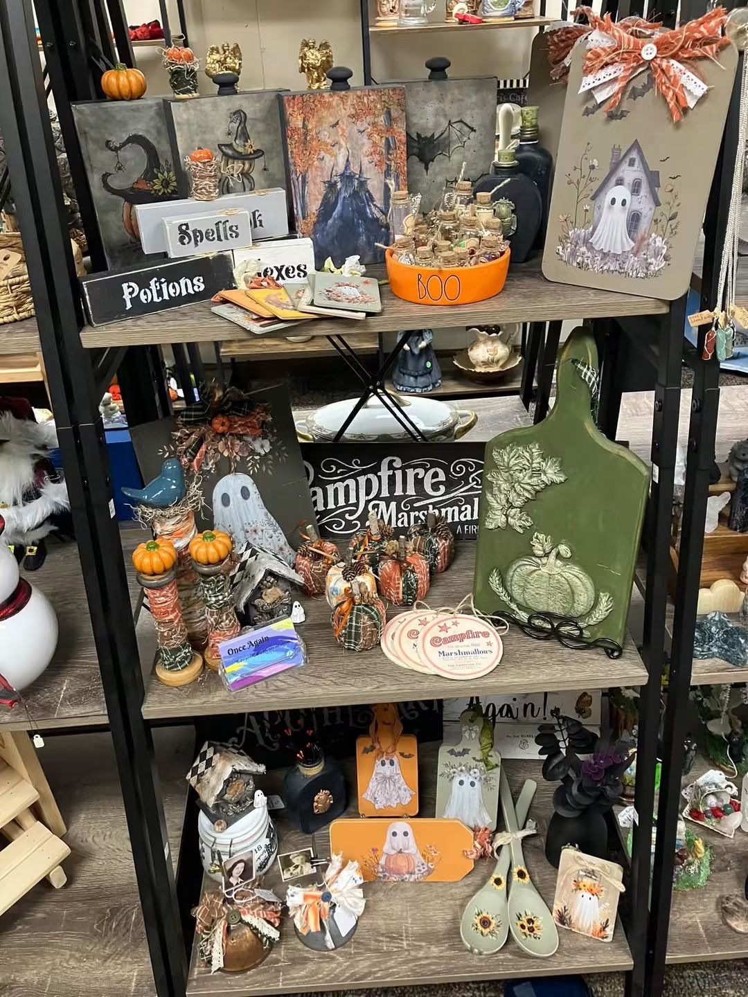 Once Again shelves filled with fall and Halloween signs, ghost designs, pumpkins, and tabletop décor